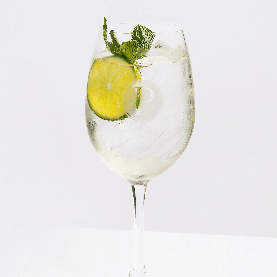 Hugo spritz cocktail in a Pinstripes logo glass garnished with mint and lime from the summer spritz menu
