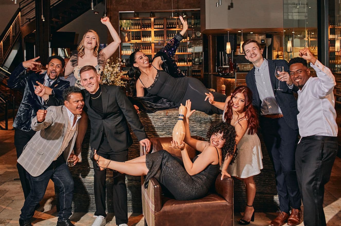 Group of coworkers having fun together at an event at Pinstripes.